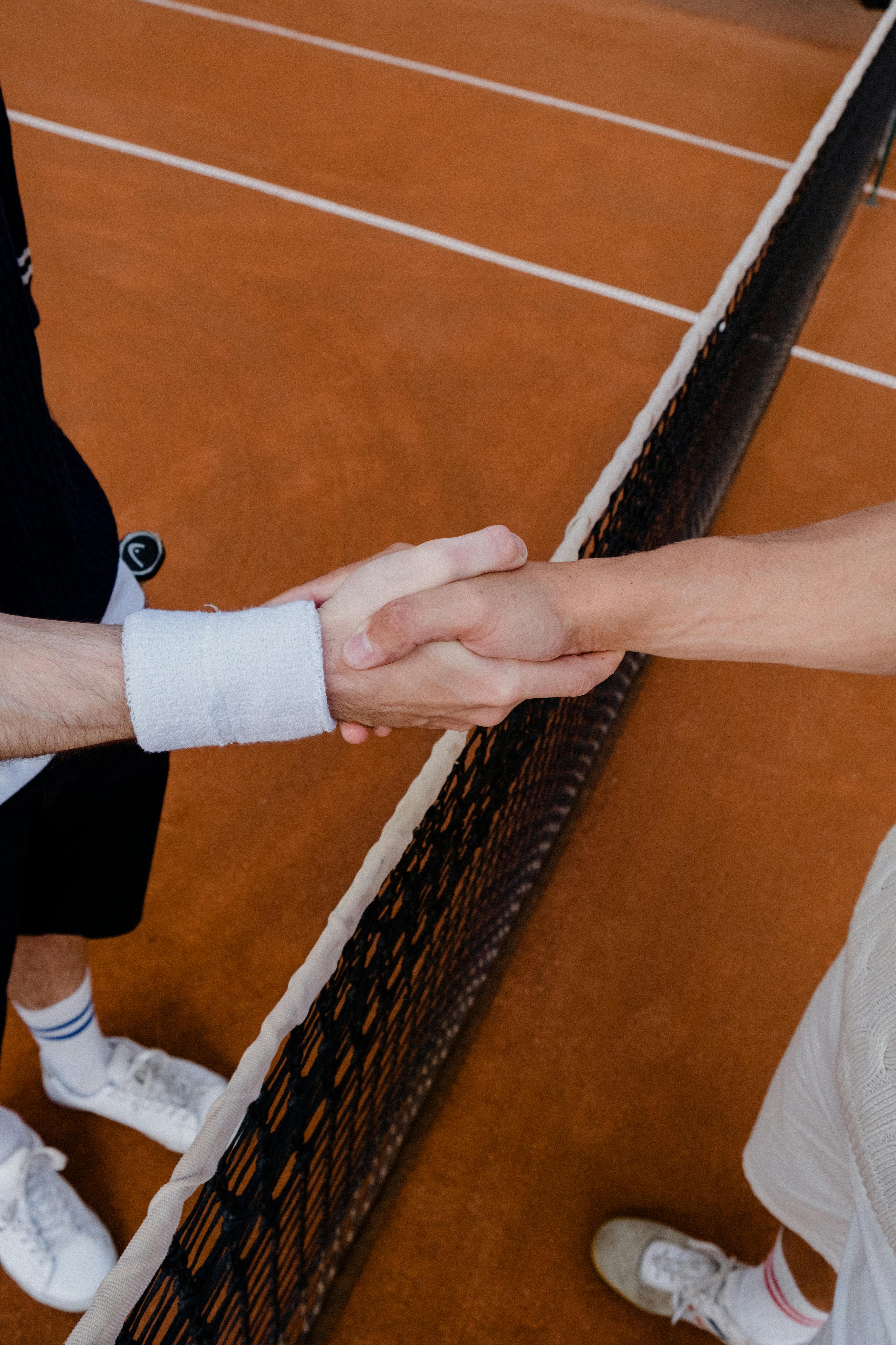 Players shaking hands on court